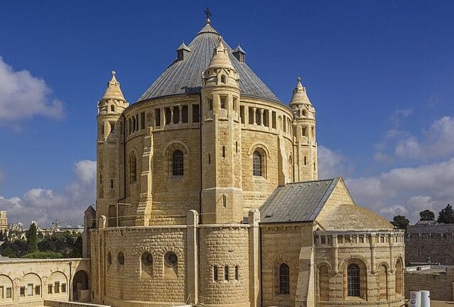 The Abbey of the Dormition of the Virgin Mary. The Solemnity of the Assumption of the Virgin Mary is celebrated on August 15. Mary was assumed body and soul into Heaven. Download the Mass Times app to find mass schedules near you, wherever you are!